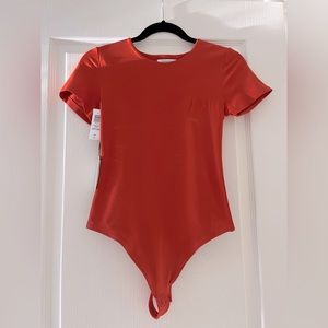 NWT Babaton bodysuit Medium